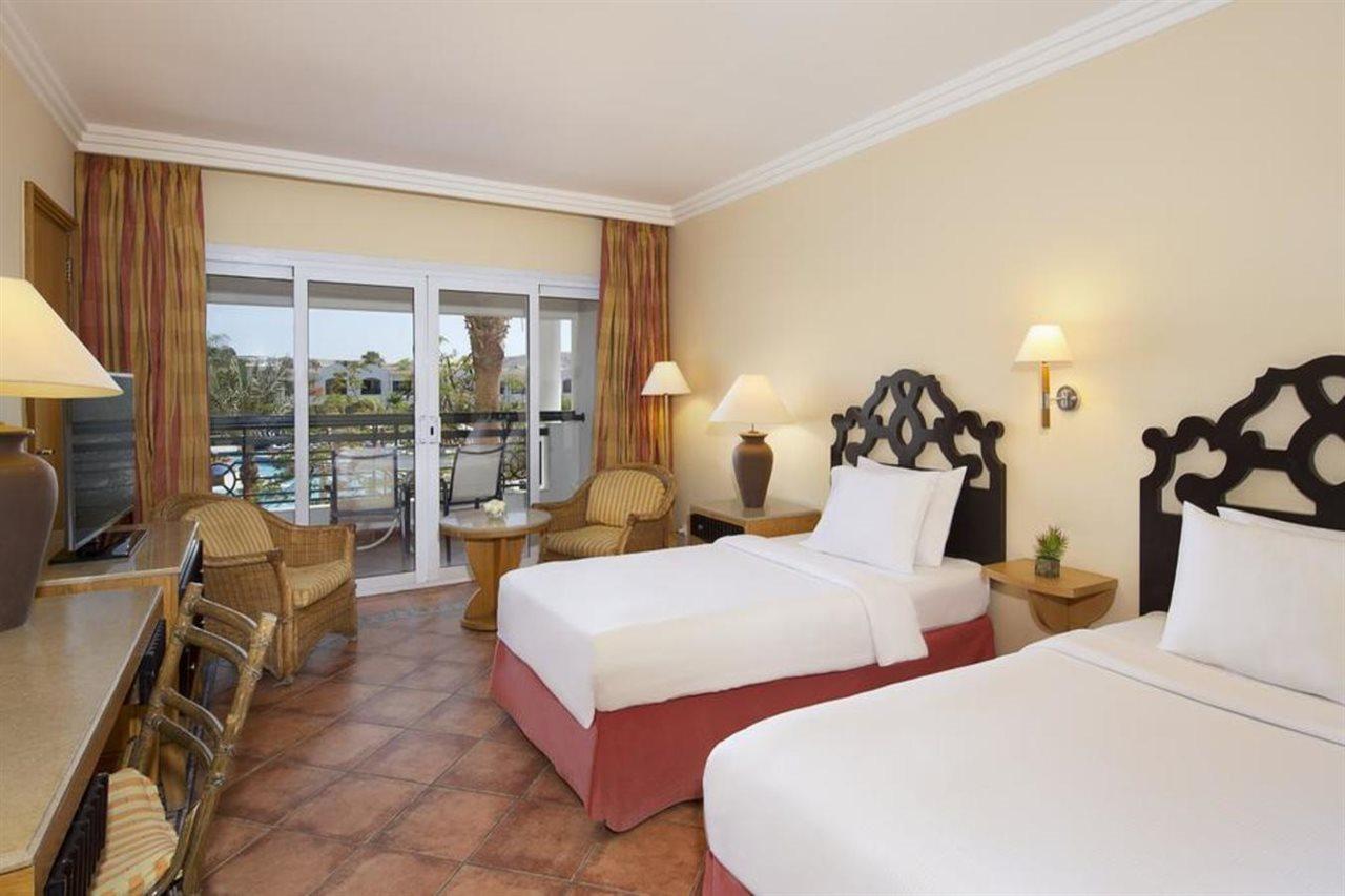Sharm Dreams Vacation Club - Aqua Park Hotel ภายนอก รูปภาพ A room at the Hilton Luxor