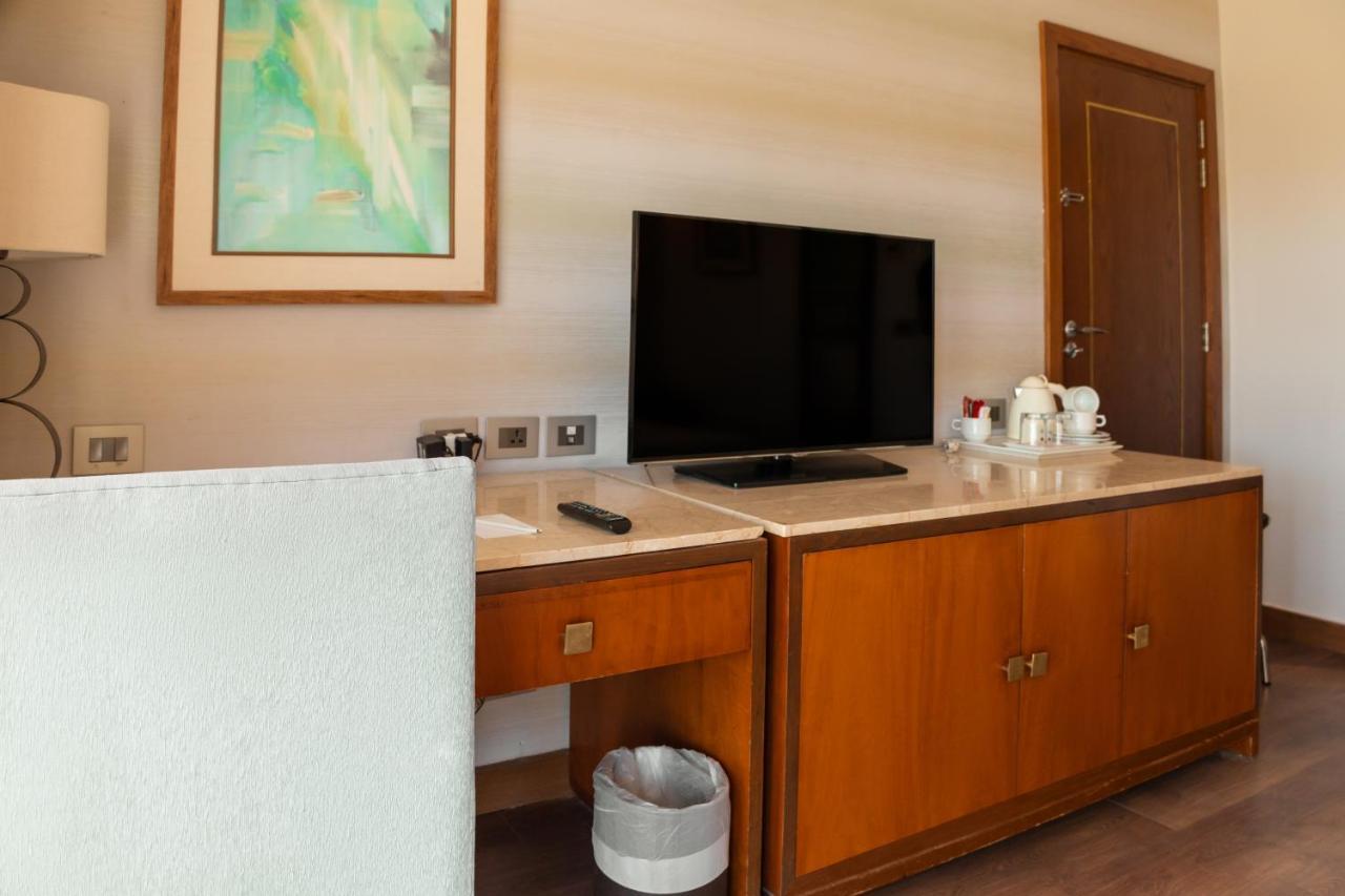 Sharm Dreams Vacation Club - Aqua Park Hotel ภายนอก รูปภาพ A television in a hotel room