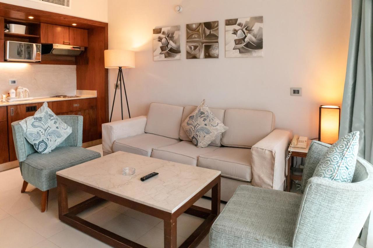 Sharm Dreams Vacation Club - Aqua Park Hotel ภายนอก รูปภาพ A living room in a hotel